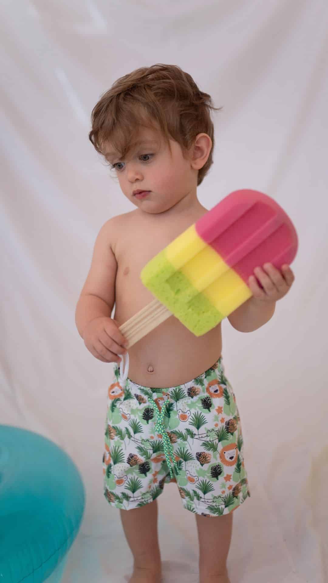 Παιδικό μαγιό βερμούδα Tortue με λιονταράκια, μπλε, UV προστασία και εσωτερικό δίχτυ